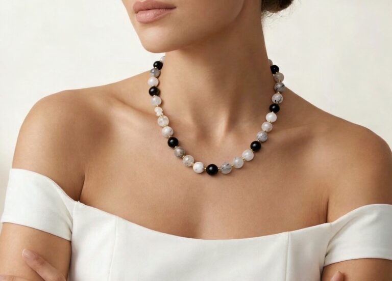 Necklace worn with an open collar