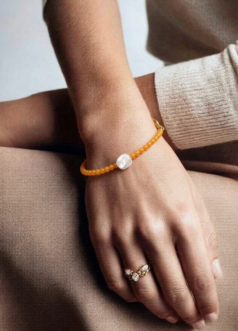 Necklace worn with an open collar