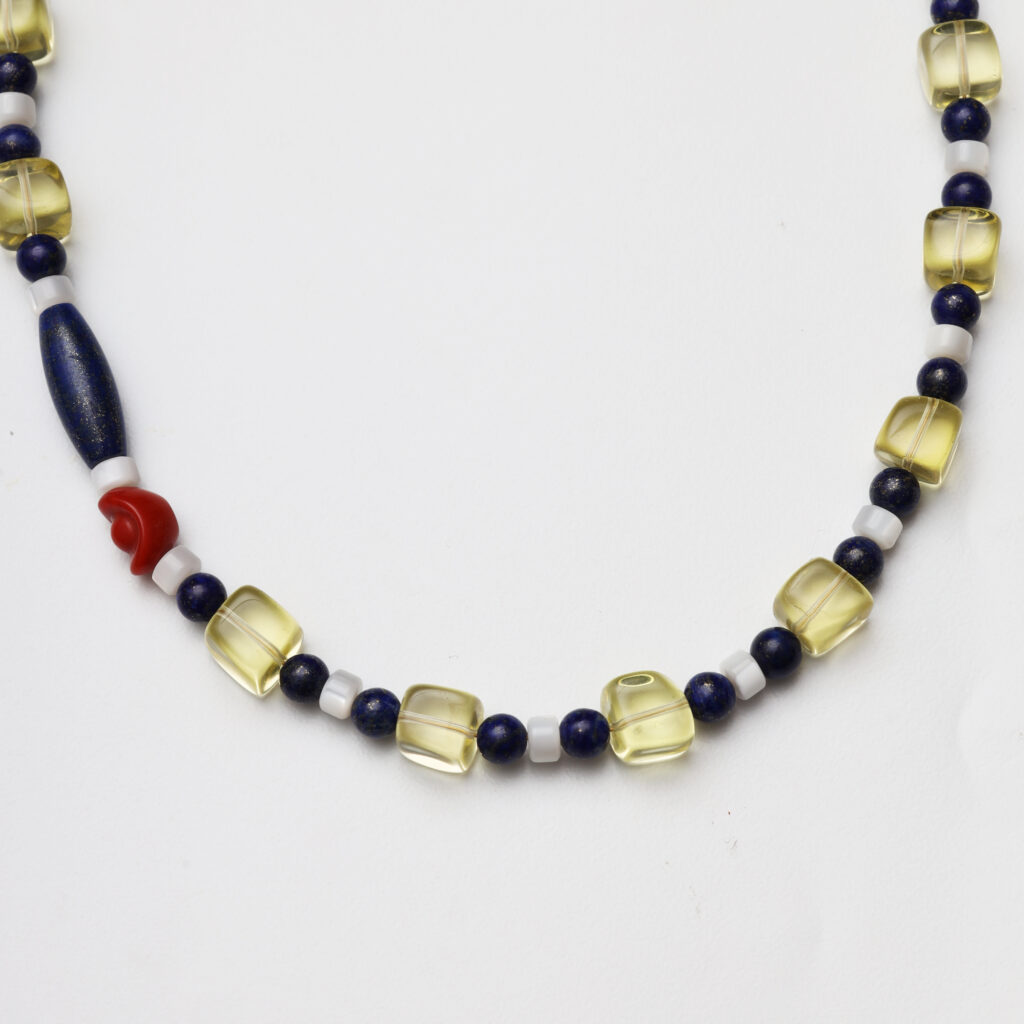 A model wearing the Moon Whisper necklace in soft light