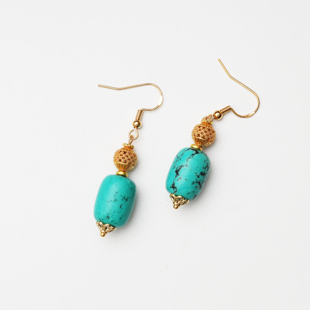 Natural turquoise drop earrings with gold details for everyday styling
