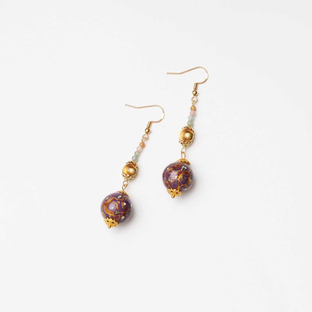 Purple gemstone drop earrings with delicate gold details