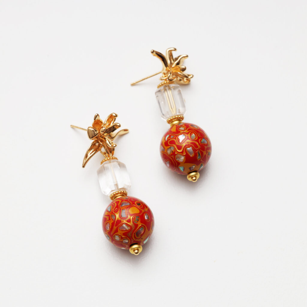Red gemstone drop earrings with clear crystal and gold floral details