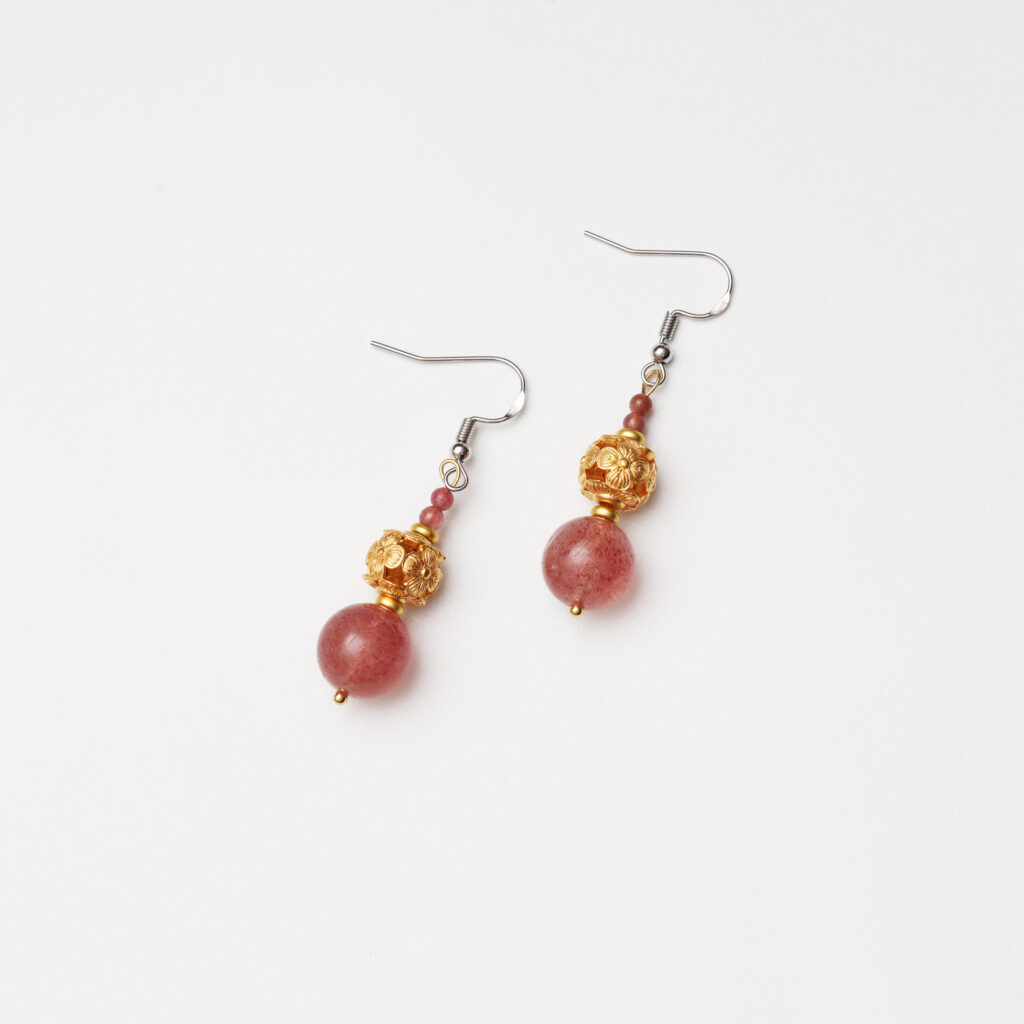 Natural gemstone earrings with strawberry quartz and pink tourmaline in angled view