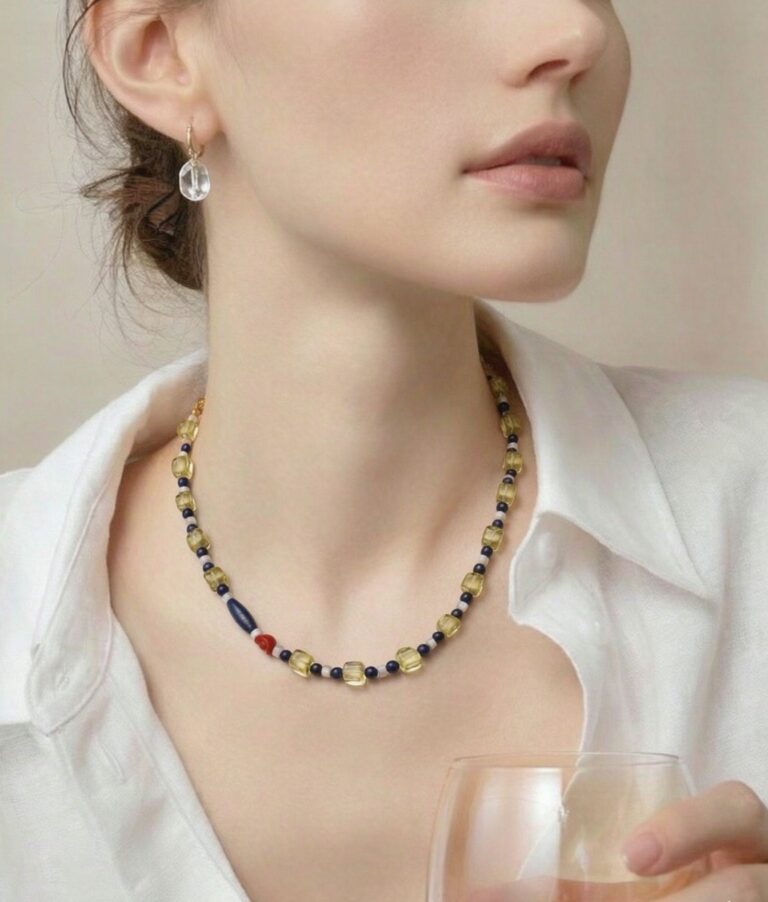 Necklace worn with an open collar