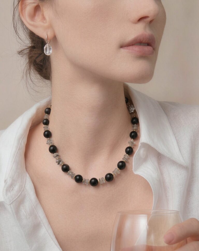 Necklace worn with an open collar