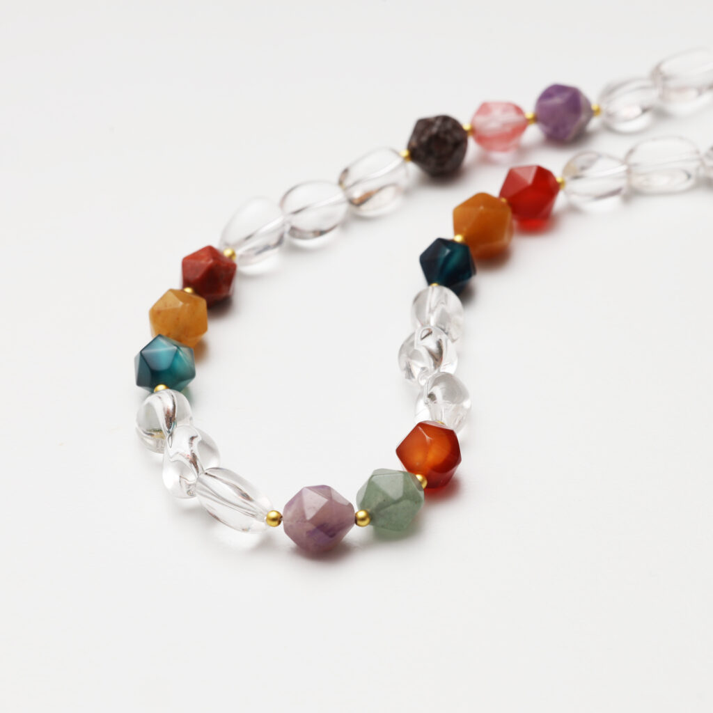 A model wearing the Moon Whisper necklace in soft light