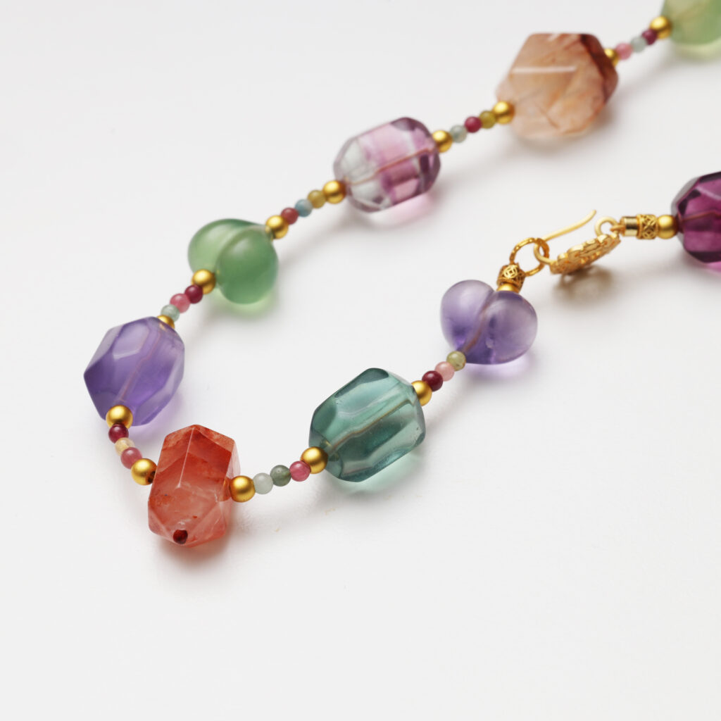 A model wearing the Moon Whisper necklace in soft light