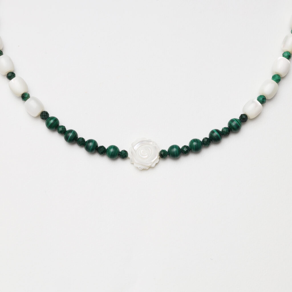 A model wearing the Moon Whisper necklace in soft light