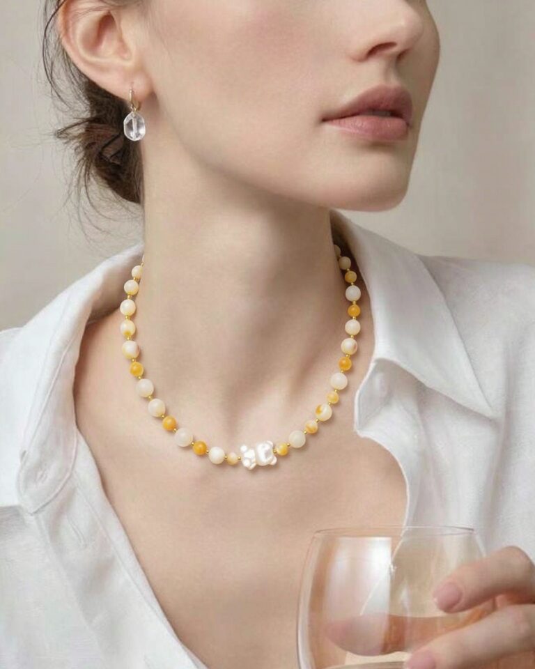 Necklace worn with an open collar