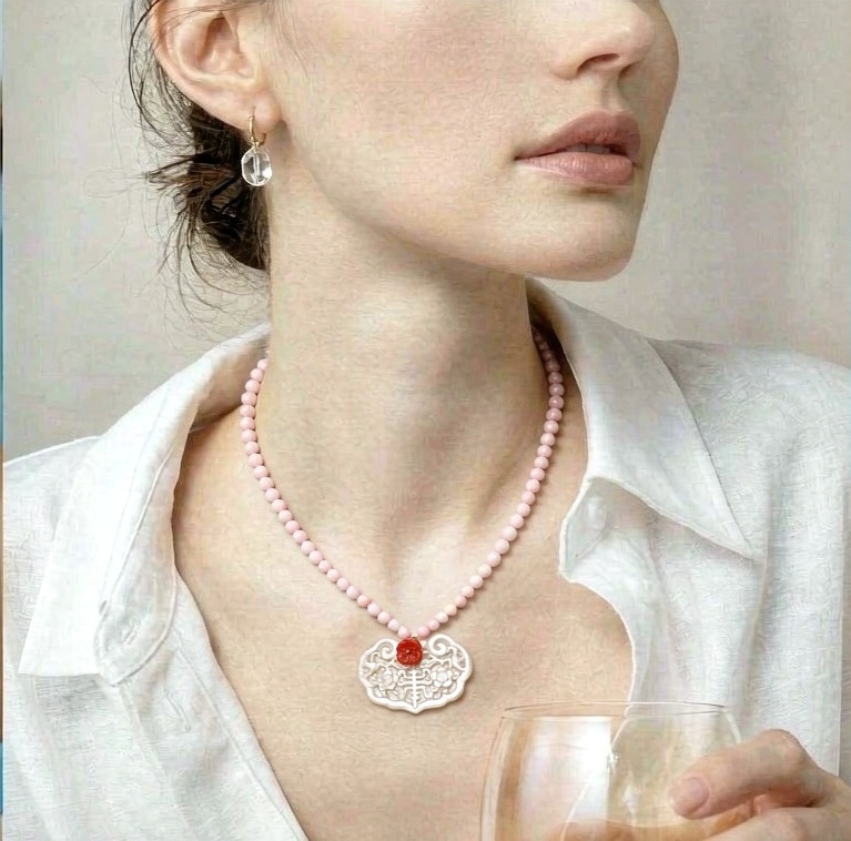 Necklace worn with an open collar
