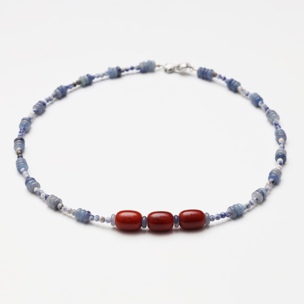 A model wearing the Moon Whisper necklace in soft light